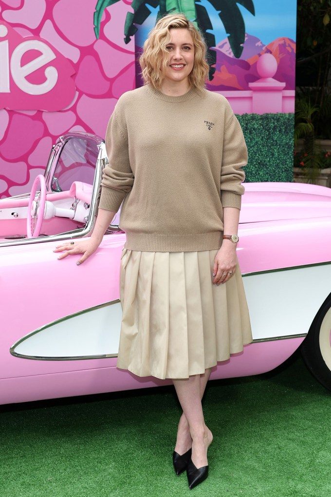 Greta Gerwig near a car