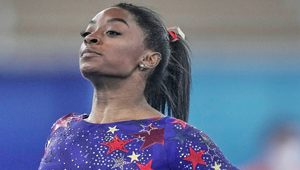 Simone Biles doing gymnastics.