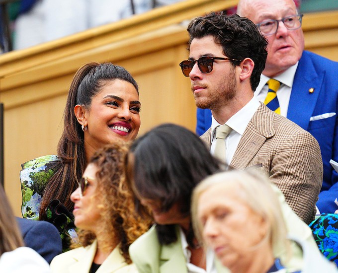 Priyanka Chopra & Nick Jonas sitting in their seats