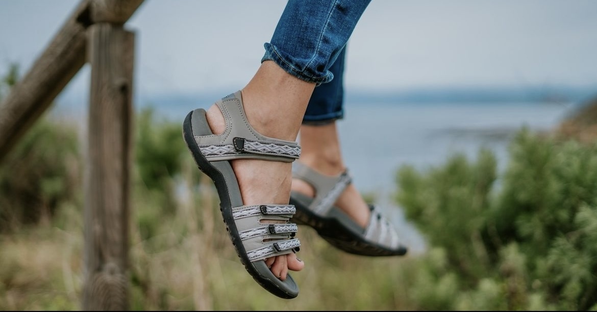 A woman wears hiking sandals