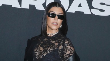 Kourtney Kardashian Rocks Fishnet Dress and Cradles Baby Bump: Photos