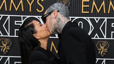 Kourtney Kardashian and Travis Barker kissing at the Emmys