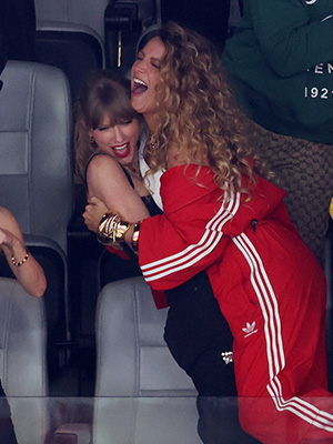Taylor Swift lifting Blake Lively at Super Bowl LVIII