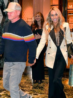 Dominic Purcell and Tish Cyrus holding hands