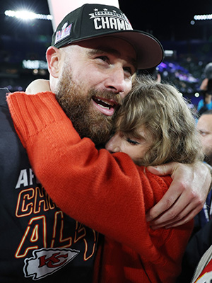 Travis Kelce hugging Taylor Swift