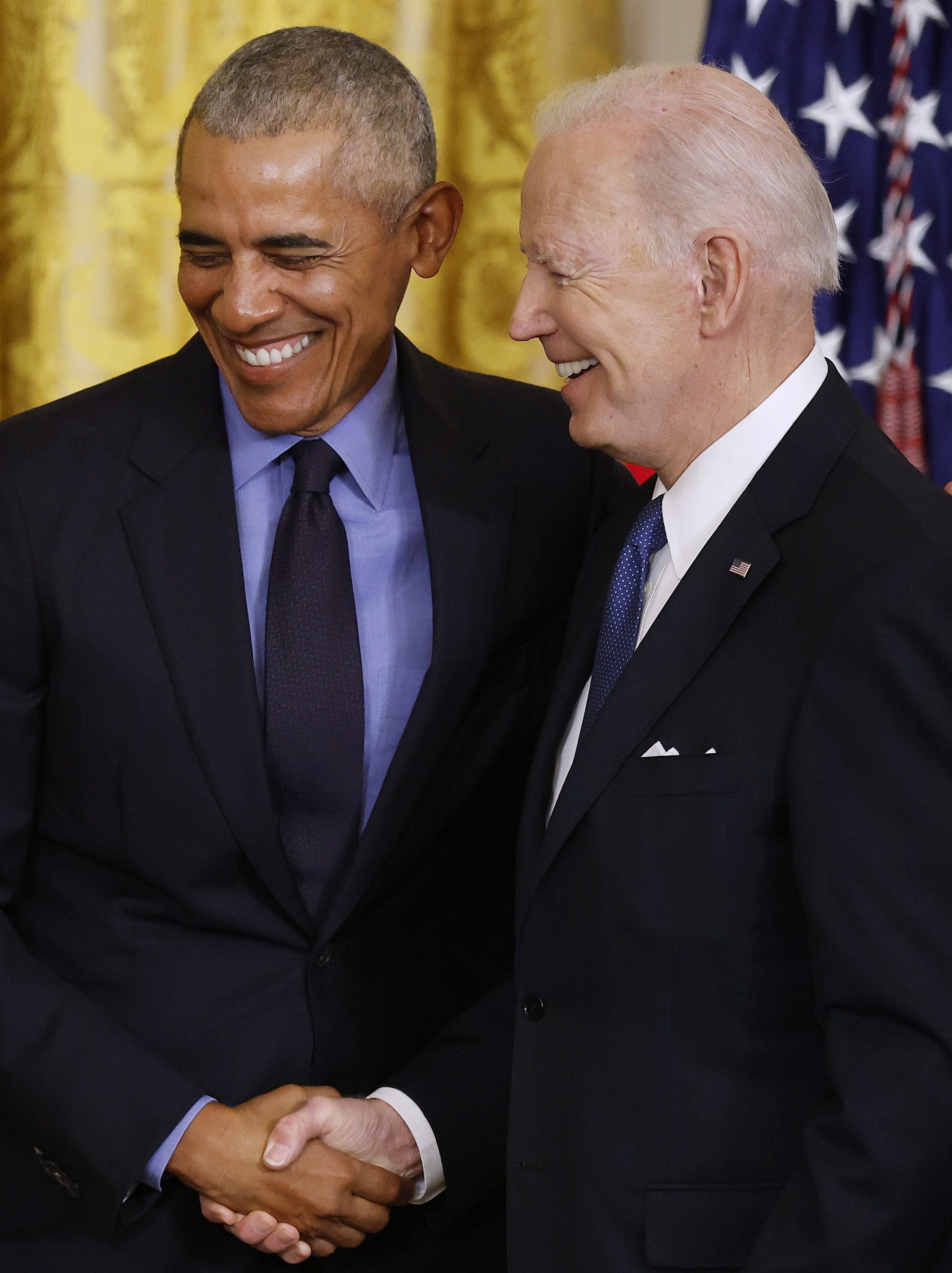 WASHINGTON, DC - APRIL 05: Former President Barack Obama (L) and U.S. President Joe Biden shake hands during an event to mark the 2010 passage of the Affordable Care Act in the East Room of the White House on April 05, 2022 in Washington, DC. With then-Vice President Joe Biden by his side, Obama signed 'Obamacare' into law on March 23, 2010.  (Photo by Chip Somodevilla/Getty Images)