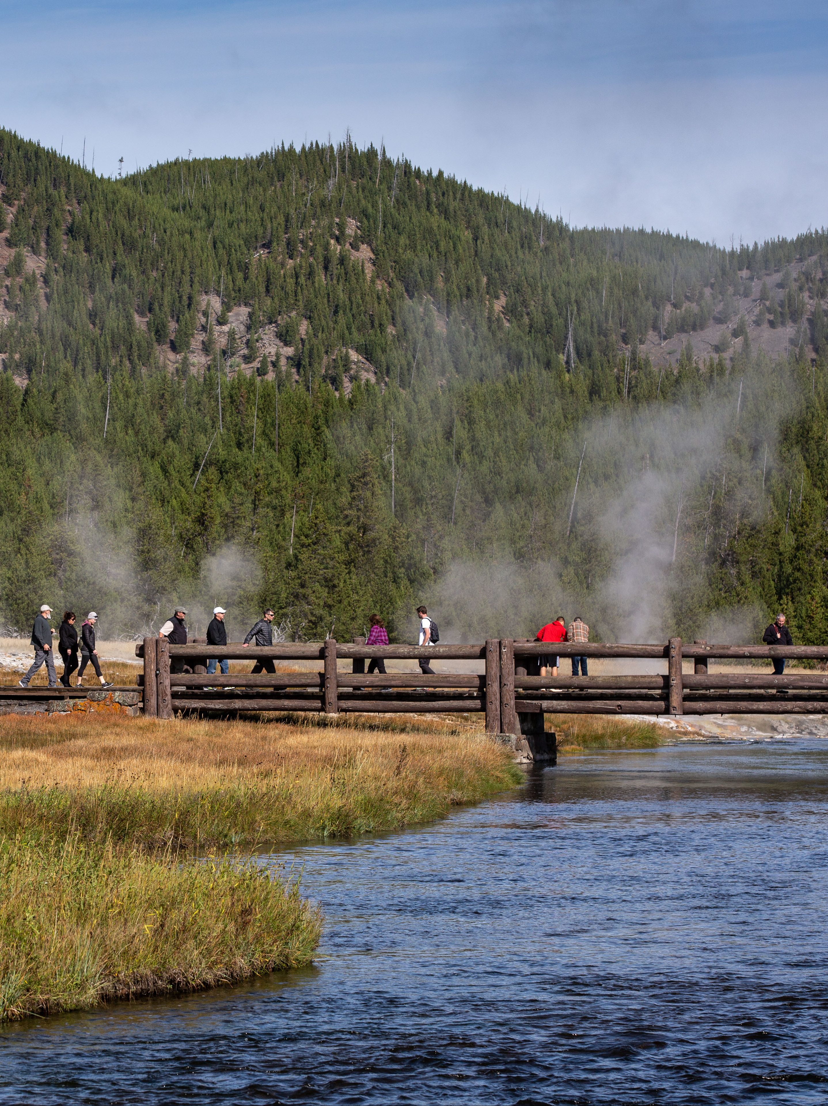 YELLOWSTONE NATIONAL PARK, WY - SEPTEMBER 18: The boardwalk across the Firehole River in Yellowstone National Park's Biscuit Basin is viewed on September 18, 2022, in Yellowstone National Park, Wyoming. Sitting atop an active volcanic caldera, Yellowstone, America's first National Park, is home to more geological hydrothermal features (geysers, mud pots, hot springs, fumaroles) than are found in the rest of the world combined. (Photo by George Rose/Getty Images)