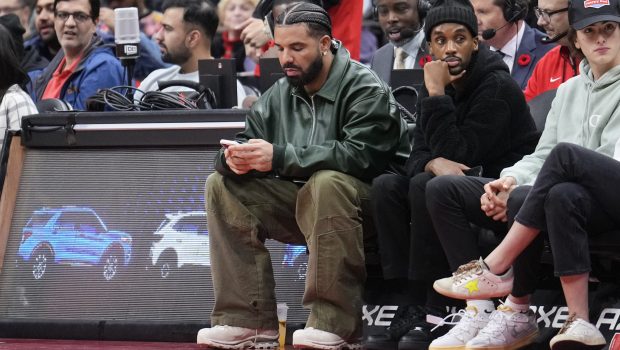 TORONTO, ON - NOVEMBER 6: Drake uses his phone as him and Future the Prince watch the game between the Toronto Raptors and the Chicago Bulls at the Scotiabank Arena on November 6, 2022 in Toronto, Ontario, Canada. NOTE TO USER: User expressly acknowledges and agrees that, by downloading and/or using this Photograph, user is consenting to the terms and conditions of the Getty Images License Agreement. (Photo by Mark Blinch/Getty Images)