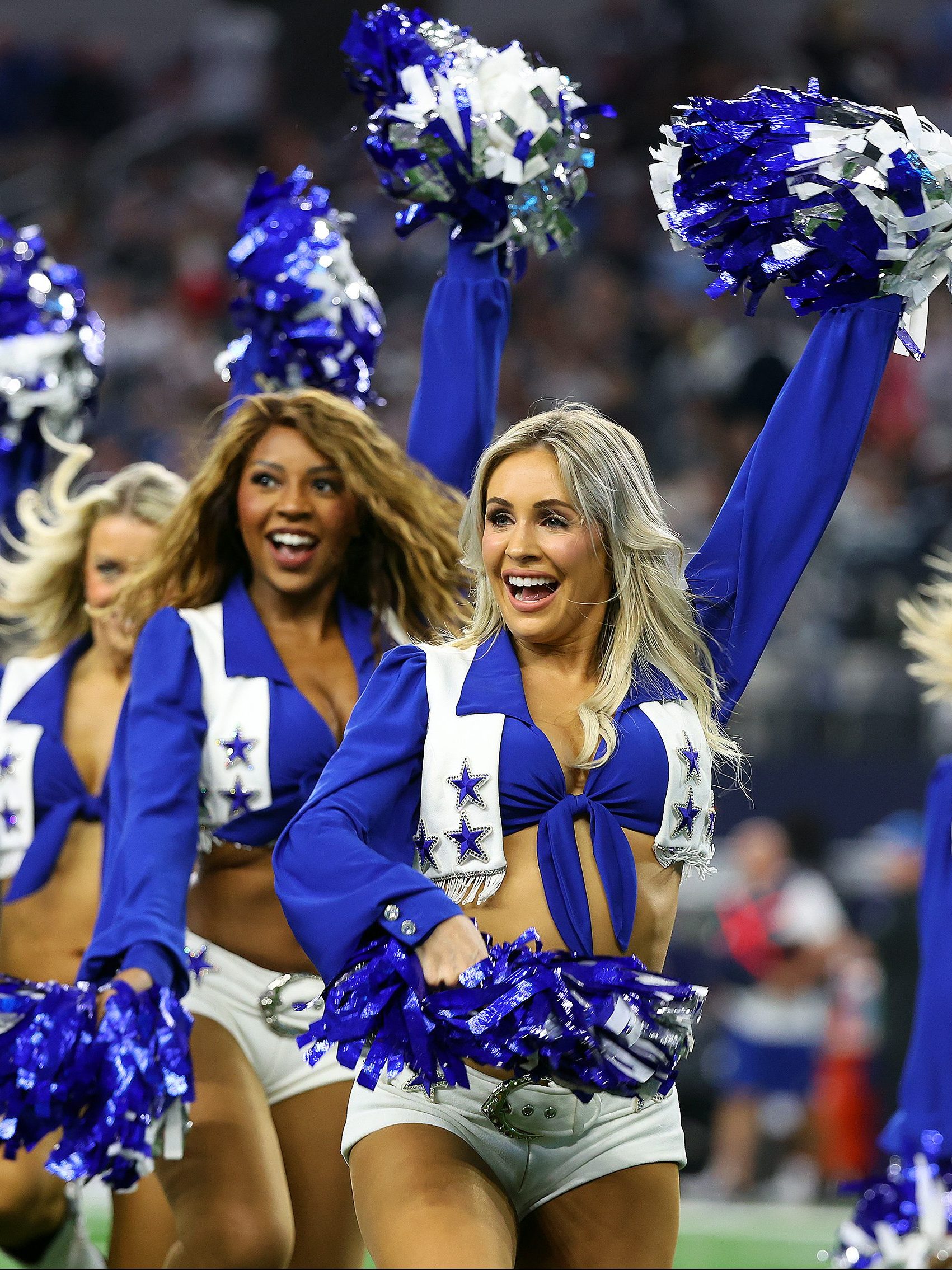 The Dallas Cowboys Cheerleaders perform during a game against the Detroit Lions