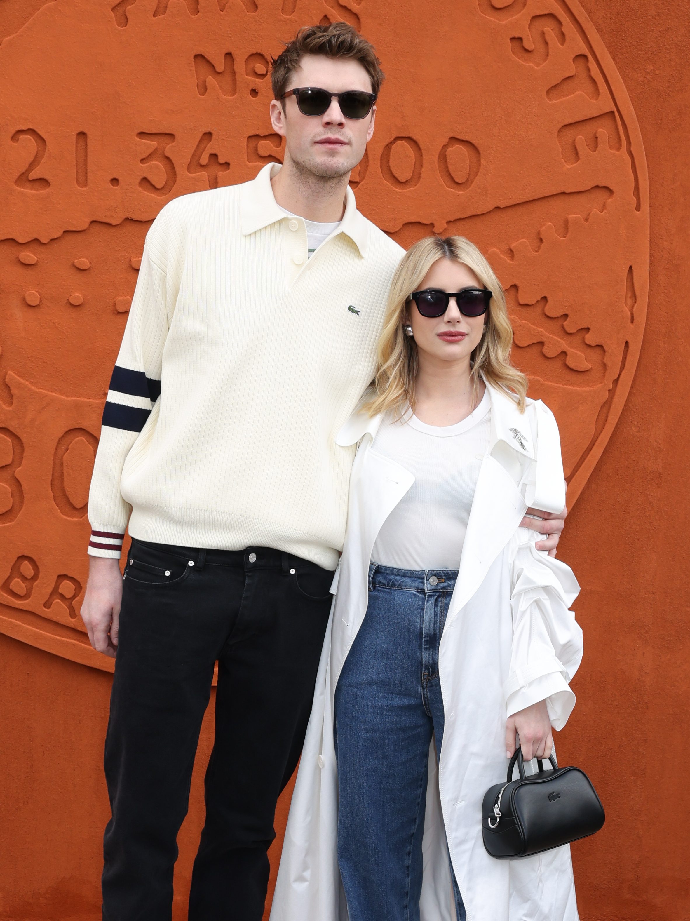 PARIS, FRANCE - MARCH 05: (EDITORIAL USE ONLY - For Non-Editorial use please seek approval from Fashion House) Cody John 
 and Emma Roberts attends the Lacoste Womenswear Fall/Winter 2024-2025 show as part of Paris Fashion Week on March 05, 2024 in Paris, France. (Photo by Pierre Suu/Getty Images)