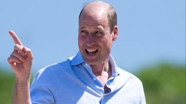 Prince William smiling on Fistral Beach