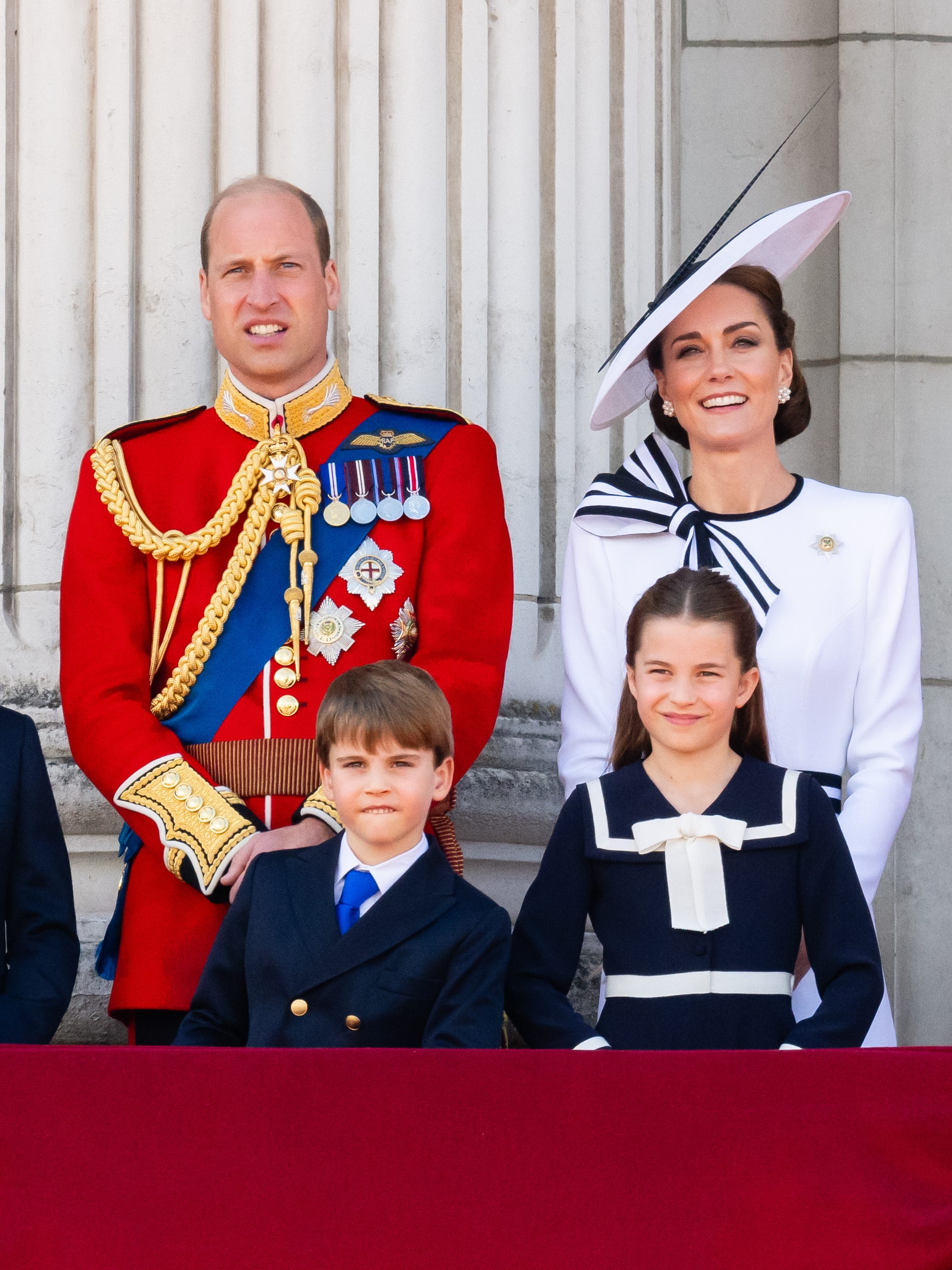 LONDON, ENGLAND - JUNE 15: Prince George of Wales, Prince William, Prince of Wales, Prince Louis of Wales, Princess Charlotte of Wales and Catherine, Princess of Wales during Trooping the Colour on June 15, 2024 in London, England. Trooping the Colour is a ceremonial parade celebrating the official birthday of the British Monarch. The event features over 1,400 soldiers and officers, accompanied by 200 horses. More than 400 musicians from ten different bands and Corps of Drums march and perform in perfect harmony. (Photo by Samir Hussein/WireImage)