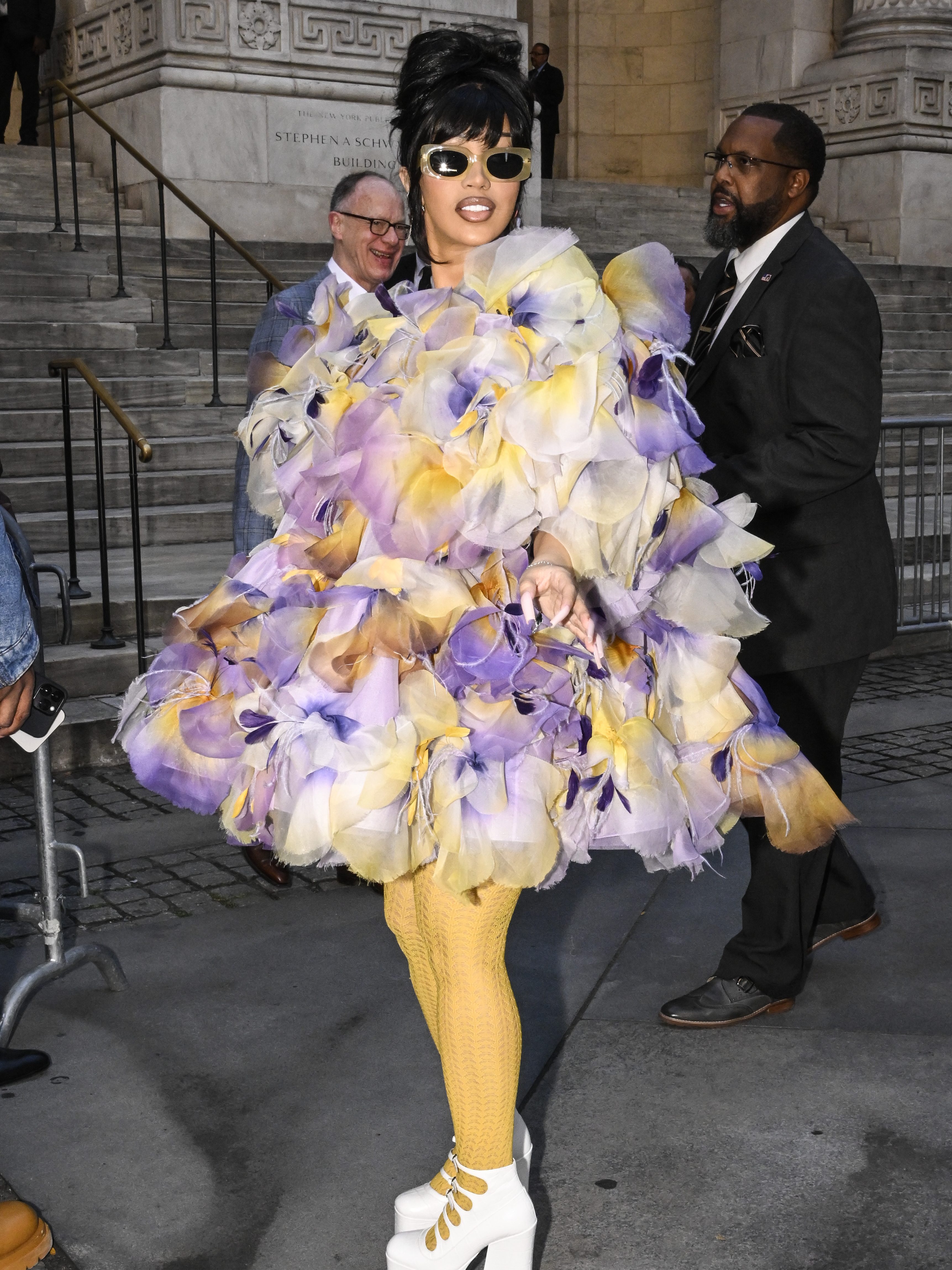 NEW YORK, NEW YORK - JULY 01: Cardi B is seen wearing a Marc Jacobs sheer ruffled outfit, yellow leggings and white Marc Jacobs shoes outside the Marc Jacobs show on July 01, 2024 in New York City. (Photo by Daniel Zuchnik/Getty Images)