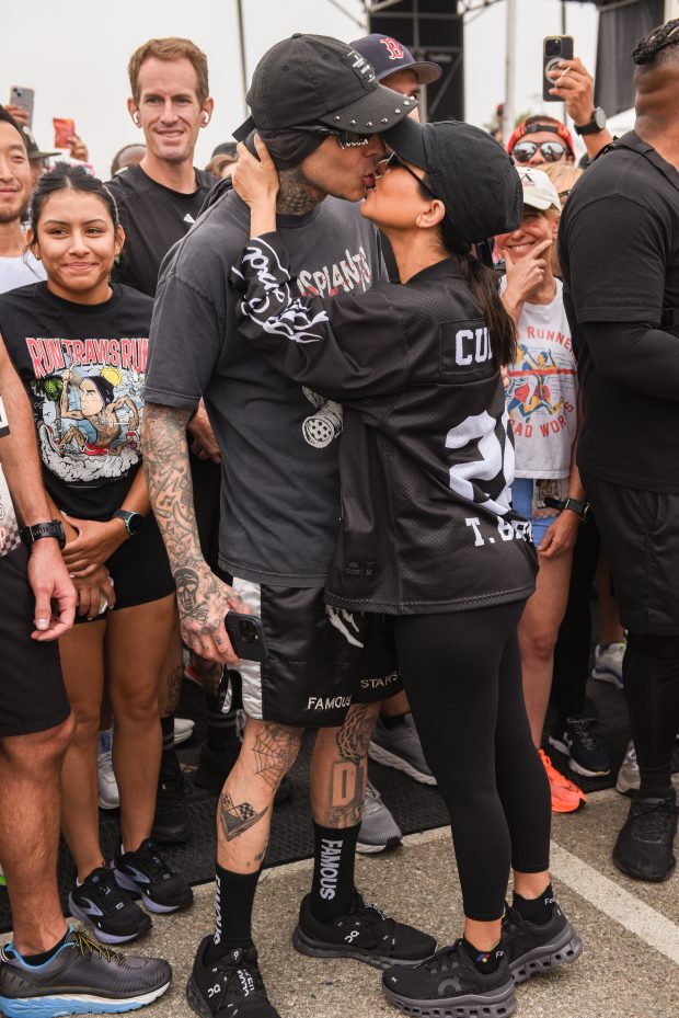 INGLEWOOD, CALIFORNIA - JULY 06: Travis Barker and Kourtney Kardashian (C) attend Travis Barker's Run Travis Run: A Run & Wellness Experience at The Kia Forum on July 06, 2024 in Inglewood, California. (Photo by Olivia Wong/Getty Images)