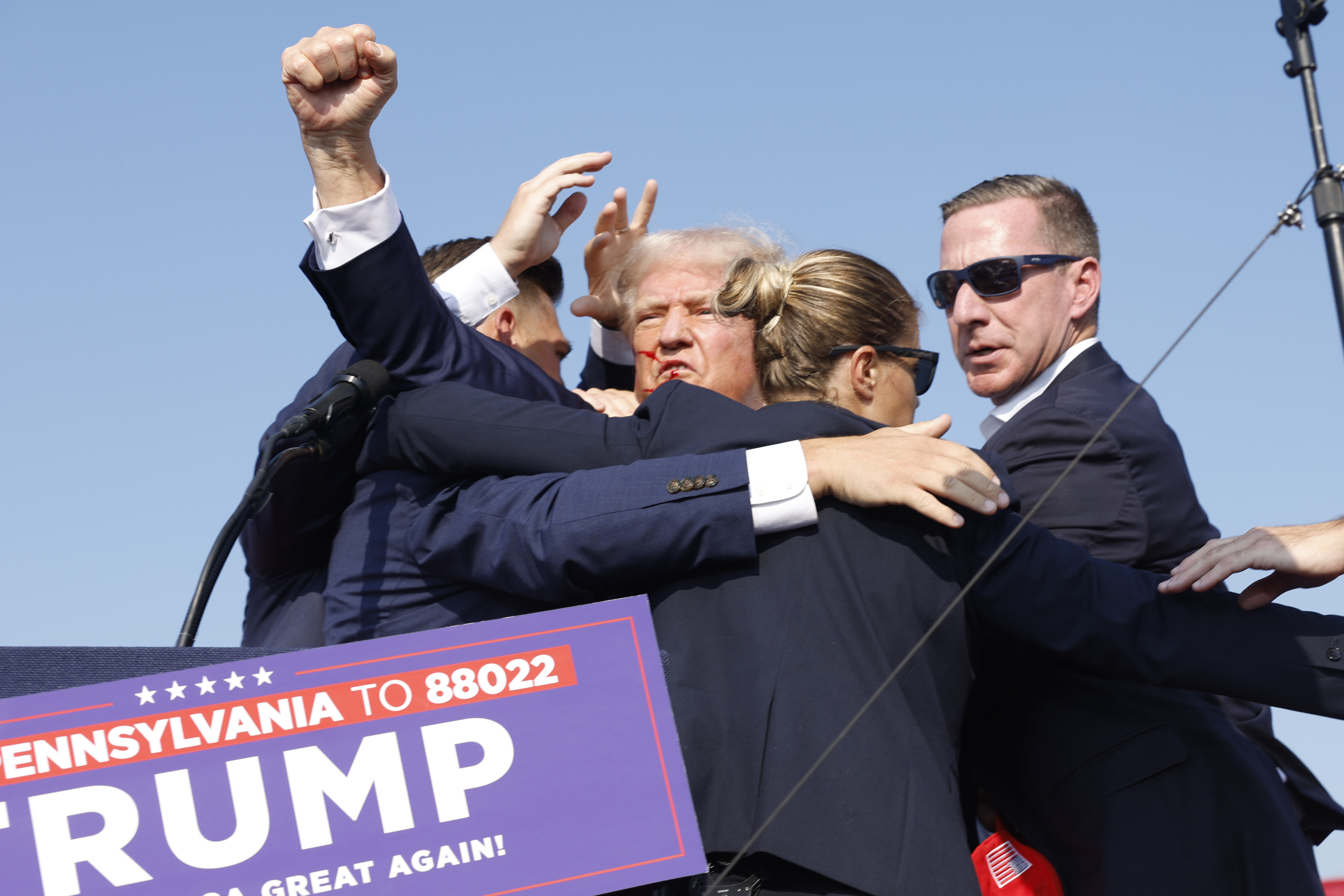 BUTLER, PENNSYLVANIA - JULY 13: Republican presidential candidate former President Donald Trump is rushed offstage during a rally on July 13, 2024 in Butler, Pennsylvania. (Photo by Anna Moneymaker/Getty Images)