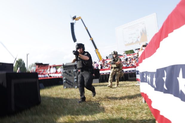 BUTLER, PENNSYLVANIA - JULY 13: Law enforcement officers move during a rally on July 13, 2024 in Butler, Pennsylvania. Butler County district attorney Richard Goldinger said the shooter is dead after injuring former U.S. President Donald Trump, killing one audience member and injuring another in the shooting. (Photo by Anna Moneymaker/Getty Images)