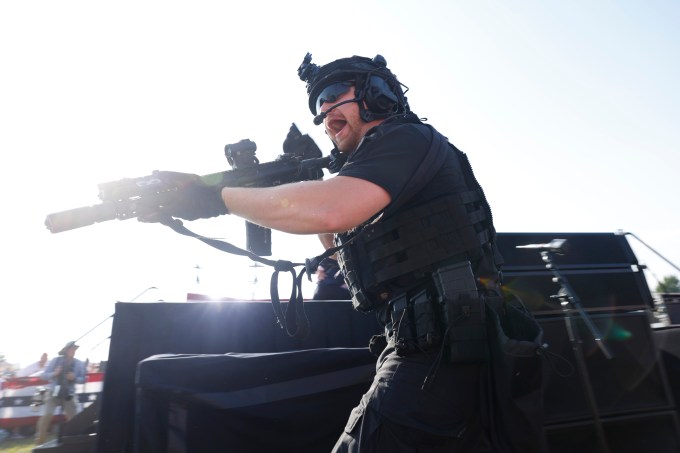 Law enforcement officers move during shooting at Trump rally