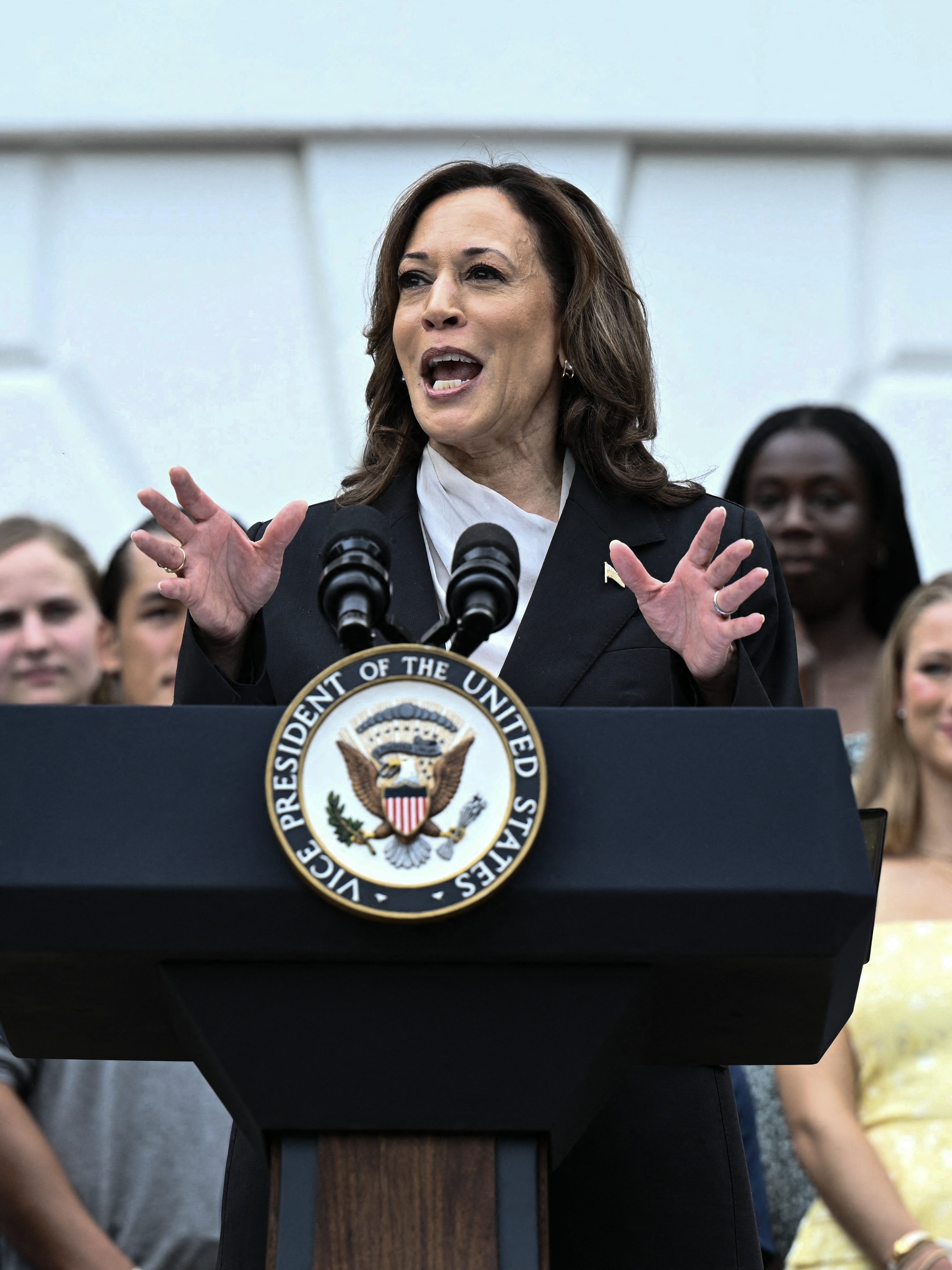 US Vice President Kamala Harris speaks during an event honoring National Collegiate Athletic Association (NCAA) championship teams from the 2023-2024 season, on the South Lawn of the White House in Washington, DC on July 22, 2024. Joe Biden on July 21, 2024 dropped out of the US presidential election and endorsed Vice President Kamala Harris as the Democratic Party's new nominee, in a stunning move that upends an already extraordinary 2024 race for the White House. Biden, 81, said he was acting in the "best interest of my party and the country" by bowing to weeks of pressure after a disastrous June debate against Donald Trump stoked worries about his age and mental fitness. (Photo by Brendan SMIALOWSKI / AFP) (Photo by BRENDAN SMIALOWSKI/AFP via Getty Images)