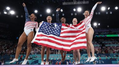 PARIS, FRANCE - JULY 30: (L-R) Jordan Chiles, Hezly Rivera,  Simone Biles, Sunisa Lee and Jade Carey of Team United States celebrate winning the gold medal during the Artistic Gymnastics Women's Team Final on day four of the Olympic Games Paris 2024 at Bercy Arena on July 30, 2024 in Paris, France. (Photo by Naomi Baker/Getty Images)