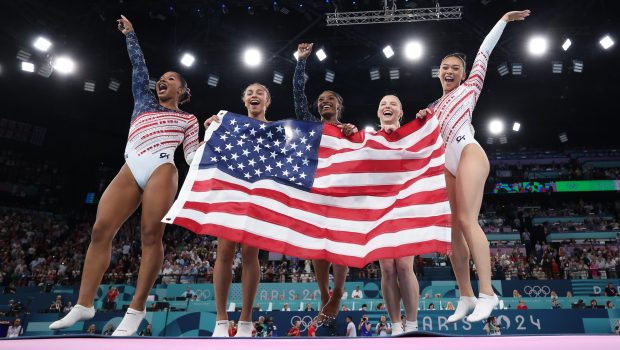 PARIS, FRANCE - JULY 30: (L-R) Jordan Chiles, Hezly Rivera, Simone Biles, Sunisa Lee and Jade Carey of Team United States celebrate winning the gold medal during the Artistic Gymnastics Women's Team Final on day four of the Olympic Games Paris 2024 at Bercy Arena on July 30, 2024 in Paris, France. (Photo by Naomi Baker/Getty Images)