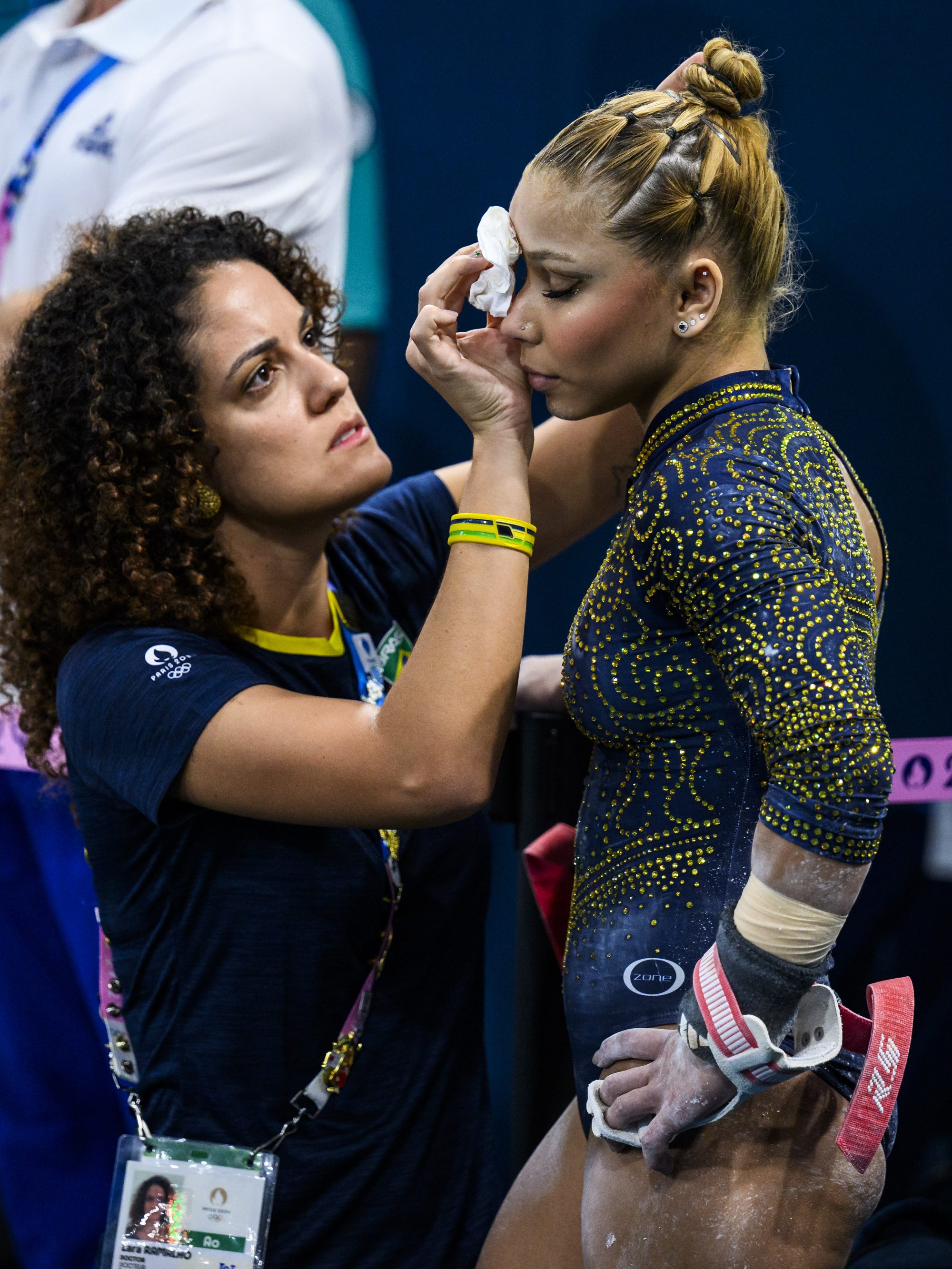 PARIS, FRANCE - JULY 30: Flavia Saraiva of Team Brazil receives medical treatment during the Artistic Gymnastics Women's Team Final on day four of the Olympic Games Paris 2024 at the Bercy Arena on July 30, 2024 in Paris, France. (Photo by Tom Weller/VOIGT/GettyImages)