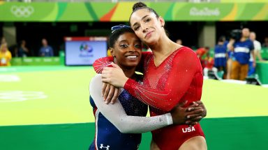 RIO DE JANEIRO, BRAZIL - AUGUST 11:  Simone Biles (L) of the United States waits for the score after competing on the floor with Alexandra Raisman (R) during the Women's Individual All Around Final on Day 6 of the 2016 Rio Olympics at Rio Olympic Arena on August 11, 2016 in Rio de Janeiro, Brazil.  (Photo by Alex Livesey/Getty Images)