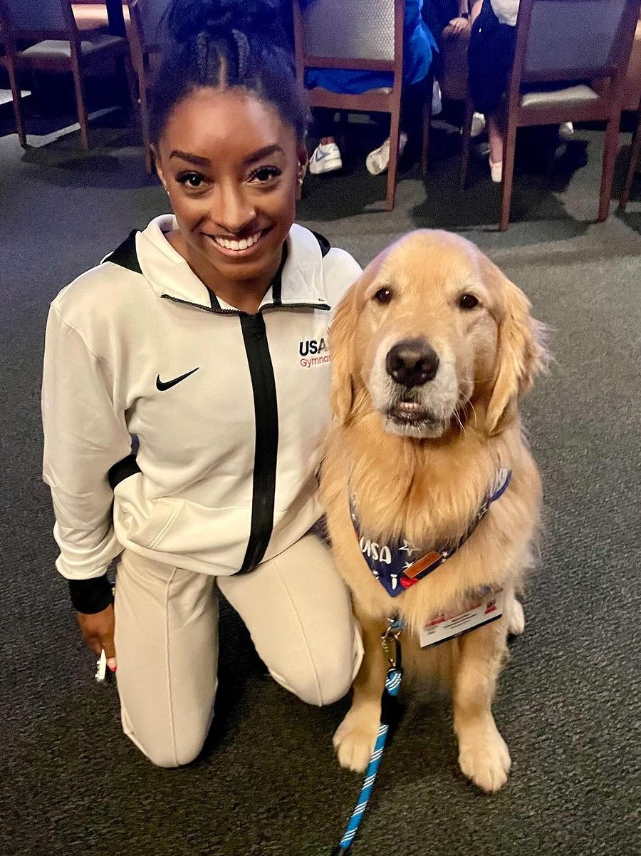 simone biles and beacon miller therapy dog at olympics