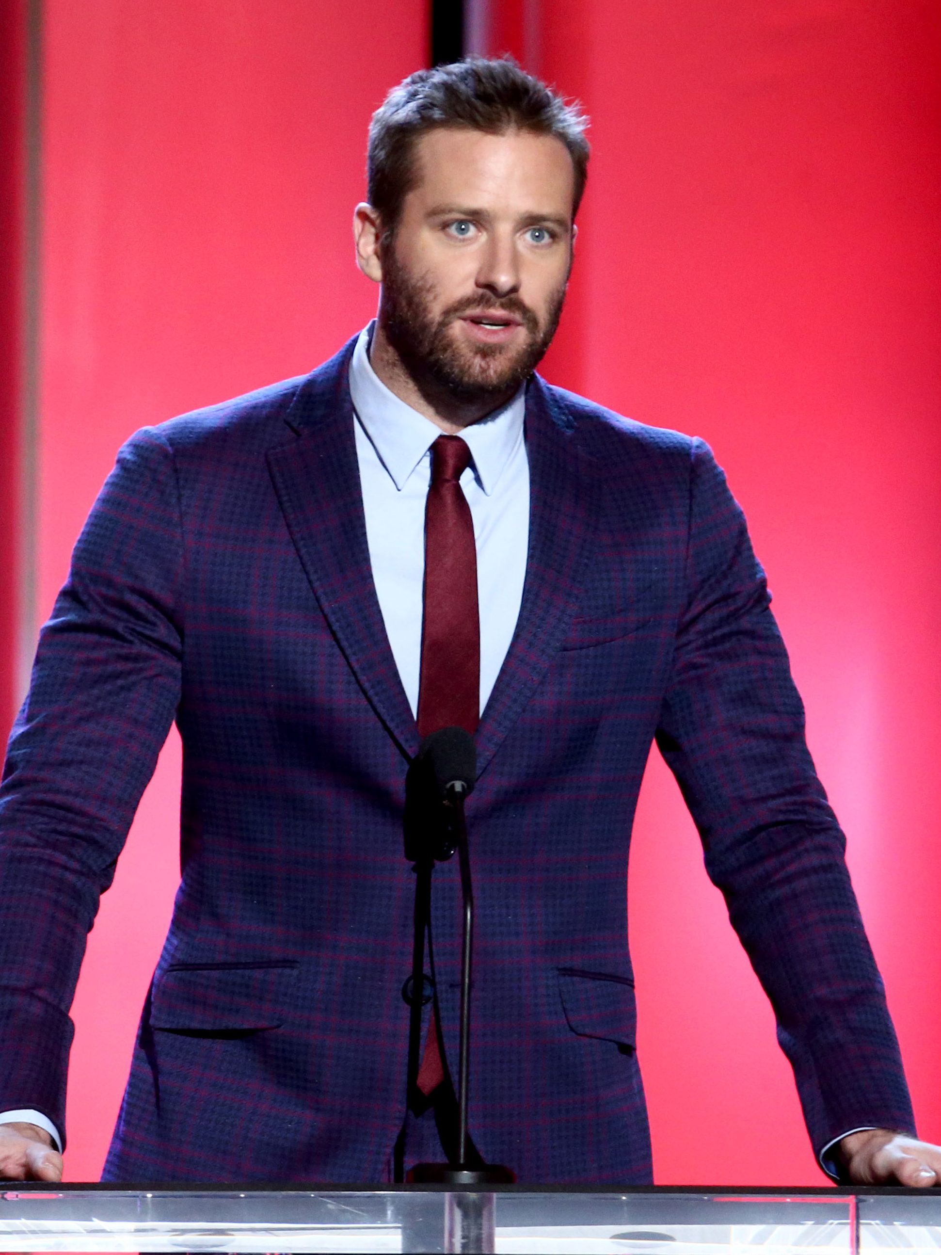 Armie Hammer speaks onstage during the 2019 Film Independent Spirit Awards