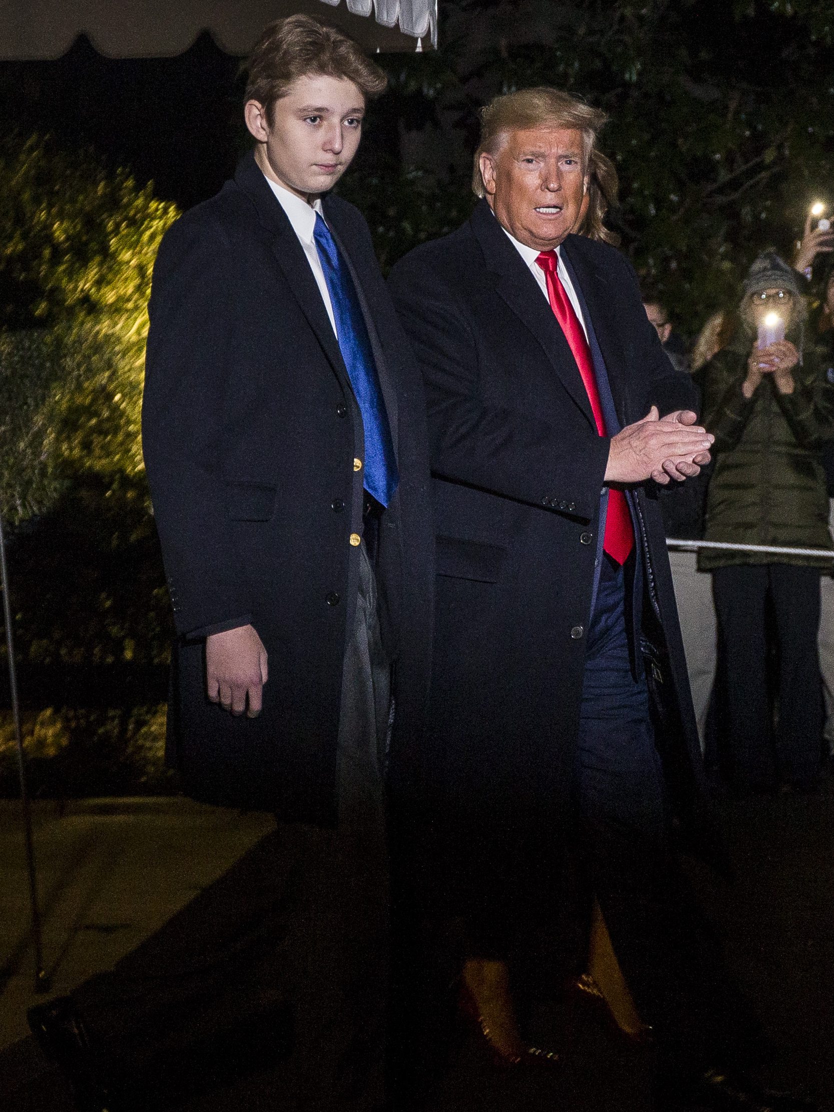 WASHINGTON, DC - DECEMBER 20: President Donald Trump leaves the White House before departing for Joint Base Andrews on December 20, 2019 in Washington, DC.  President Trump will sign S.1790, the "National Defense Authorization act for FY2020" at JBA before traveling to West Palm Beach, FL.  Also pictured is President Trump's son, Barron Trump.  (Photo by Zach Gibson/Getty Images)