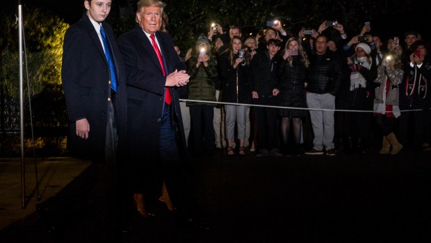 WASHINGTON, DC - DECEMBER 20: President Donald Trump leaves the White House before departing for Joint Base Andrews on December 20, 2019 in Washington, DC.  President Trump will sign S.1790, the "National Defense Authorization act for FY2020" at JBA before traveling to West Palm Beach, FL.  Also pictured is President Trump's son, Barron Trump.  (Photo by Zach Gibson/Getty Images)