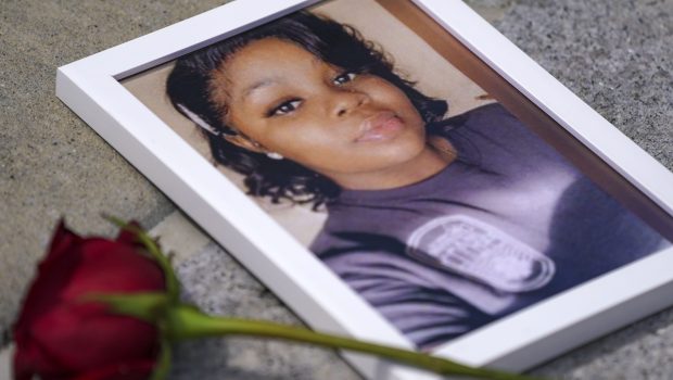 WASHINGTON, DC - JULY 30: A photo of Breonna Taylor is seen among other photos of women who have lost their lives as a result of violence during the 2nd Annual Defend Black Women March in Black Lives Matter Plaza on July 30, 2022 in Washington, DC. (Photo by Leigh Vogel/Getty Images for Frontline Action Hub)