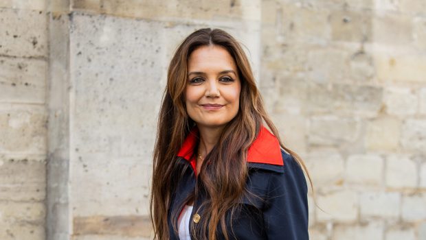 Katie Holmes in a navy red jacket during Paris Fashion Week