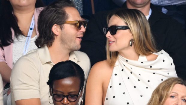 LONDON, ENGLAND - JULY 12: Tom Ackerley and Margot Robbie court-side of Centre Court on day twelve of the Wimbledon Tennis Championships at the All England Lawn Tennis and Croquet Club on July 12, 2024 in London, England. (Photo by Karwai Tang/WireImage)