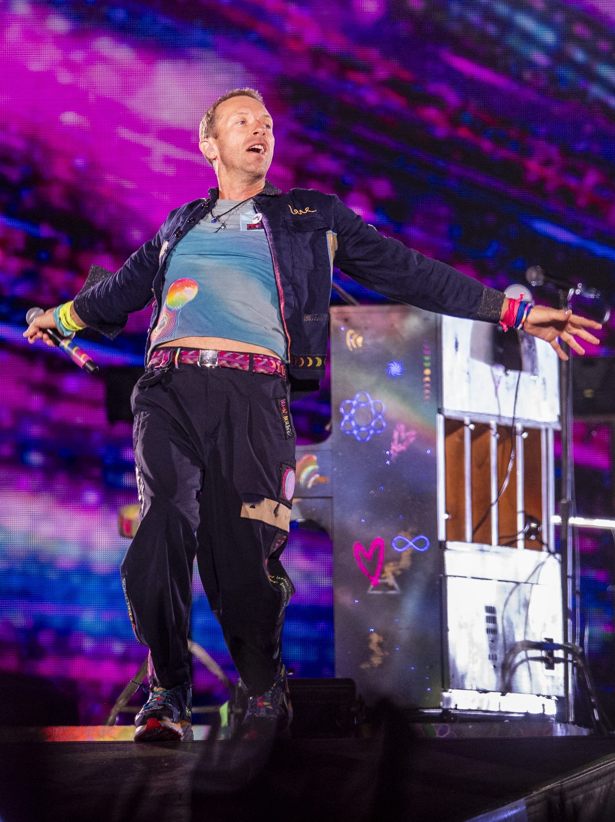 ROME, ITALY - JULY 12: (EDITORIAL USE ONLY) Jonny Buckland (L) and Chris Martin (R) of the group Coldplay Performs at Stadio Olimpico on July 12, 2024 in Rome, Italy. (Photo by Roberto Panucci - Corbis/Corbis via Getty Images)