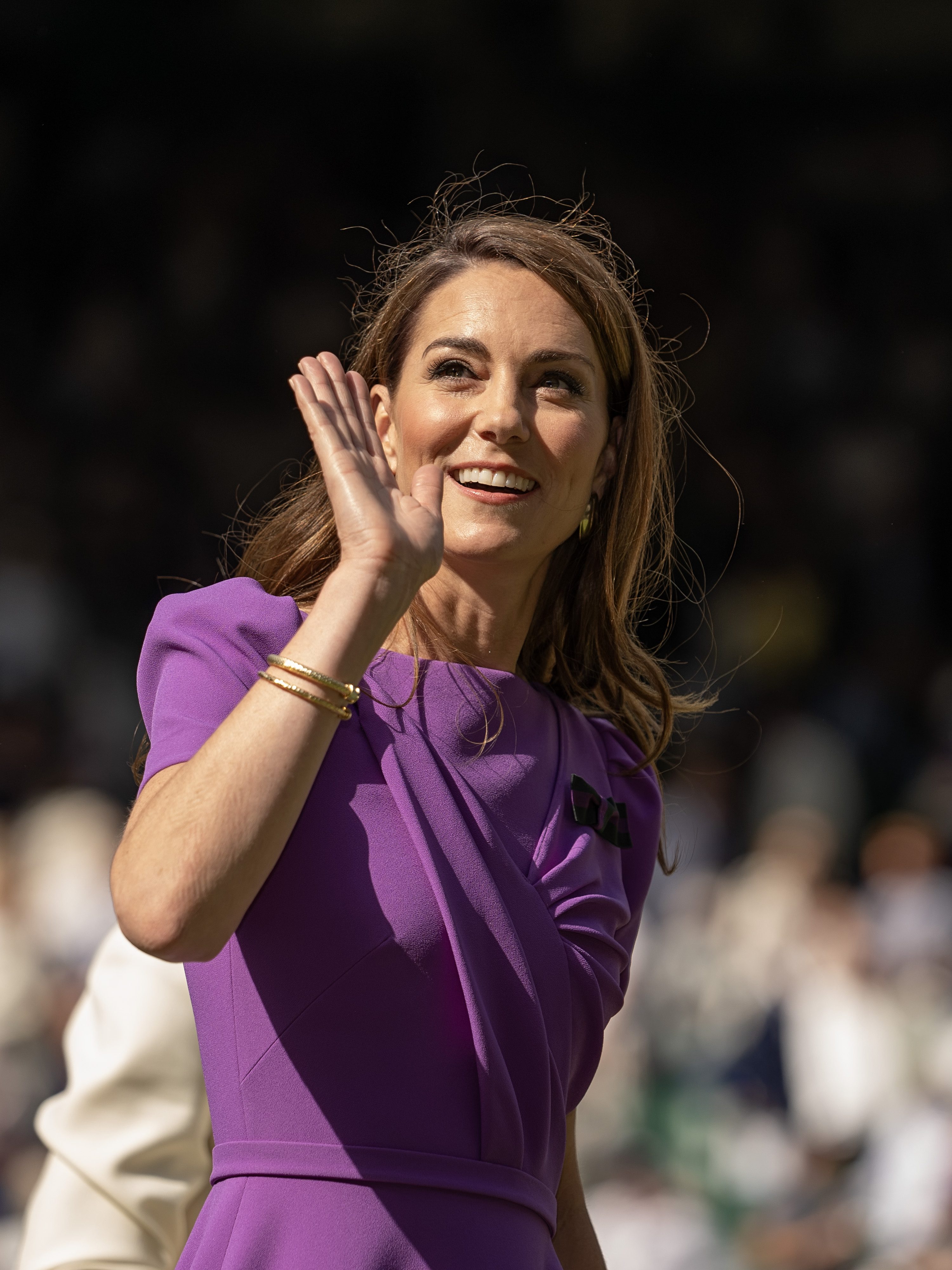 WIMBLEDON, LONDON, ENGLAND - JULY 14: Catherine, Princess of Wales, Patron of The AELTC waves to the crowd after presenting the Mens Singles trophy after the Mens Singles Final on Day 14 at All England Lawn Tennis and Croquet Club on July 14, 2024 in Wimbledon, London, England. (Photo by Fred Mullane/ISI Photos/Getty Images)