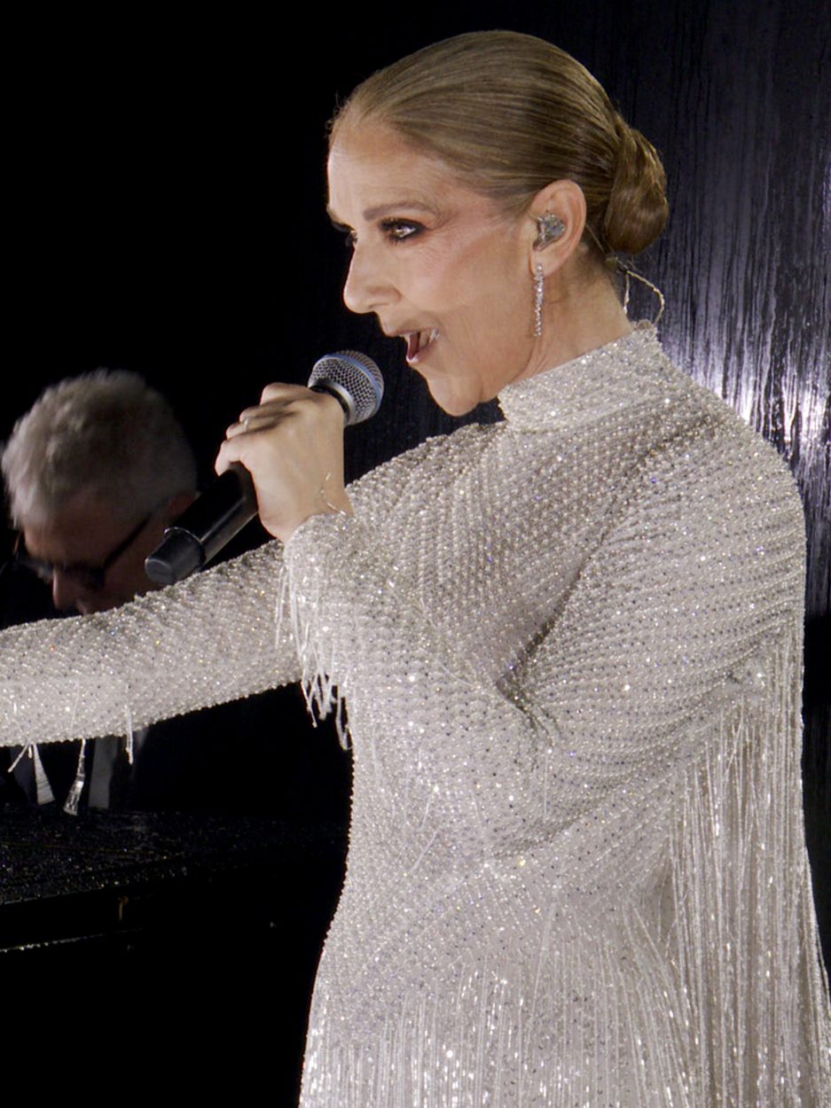 PARIS, FRANCE - JULY 26: (EDITOR'S NOTE: This Handout screengrab was provided by a third-party organization and may not adhere to Getty Images' editorial policy.) This handout released by the Olympic Broadcasting Services, shows a view of singer Celine Dion performing on the Eiffel Tower during the opening ceremony of the Paris 2024 Olympic Games Paris 2024 on July 26, 2024 in Paris, France. (Screengrab by IOC via Getty Images)