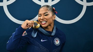 Jordan Chiles poses with the gold medal