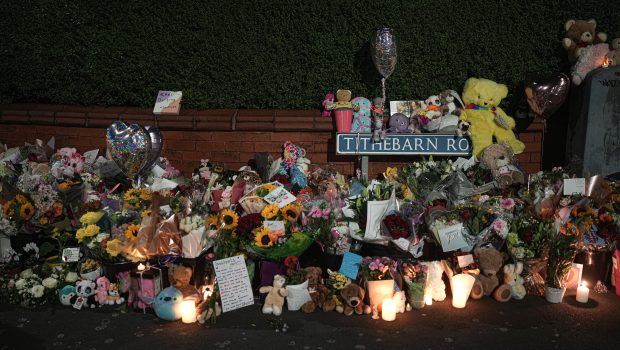 SOUTHPORT, ENGLAND - JULY 30: Tributes and candles to the victims of the Southport knife attack continue to be laid near the scene on July 30, 2024 in Southport, England. A teenager armed with a knife attacked children at a Taylor Swift-themed holiday club in Hart Lane, Southport yesterday morning. Three children have died and five children and two adults remain in a critical condition in hospital. A 17-year-old boy has been arrested.  (Photo by Christopher Furlong/Getty Images)