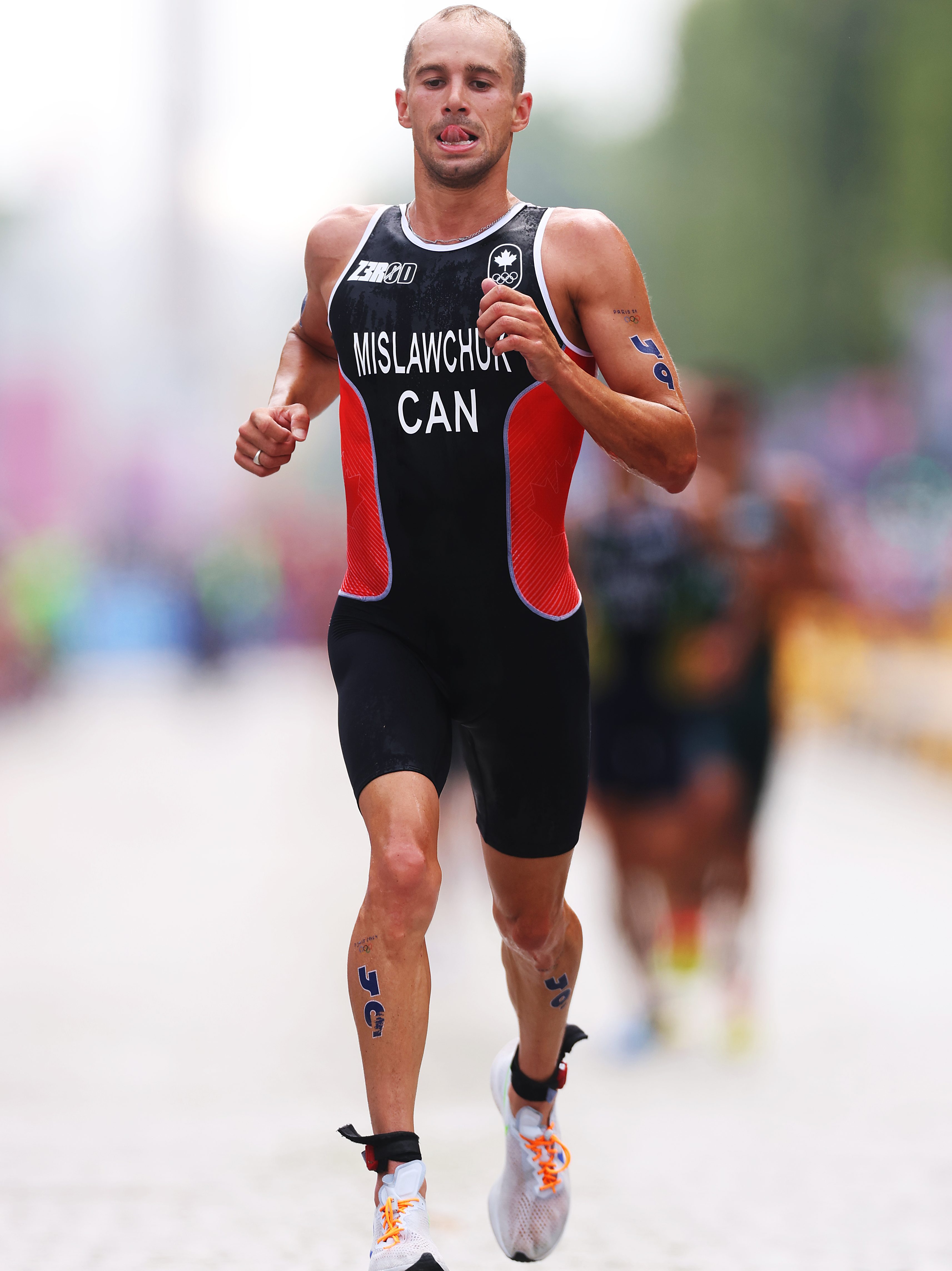 PARIS, FRANCE - JULY 31: Tyler Mislawchuk of Team Canada competes during Men's Individual Triathlon on day five of the Olympic Games Paris 2024 at Pont Alexandre III on July 31, 2024 in Paris, France. (Photo by Lars Baron/Getty Images)