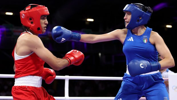 PARIS, FRANCE - AUGUST 01: Imane Khelif of Team Algeria dodges a punch from  Angela Carini of Team Italy during the Women's. 66kg preliminary round match on day six of the Olympic Games Paris 2024 at North Paris Arena on August 01, 2024 in Paris, France. (Photo by Richard Pelham/Getty Images)