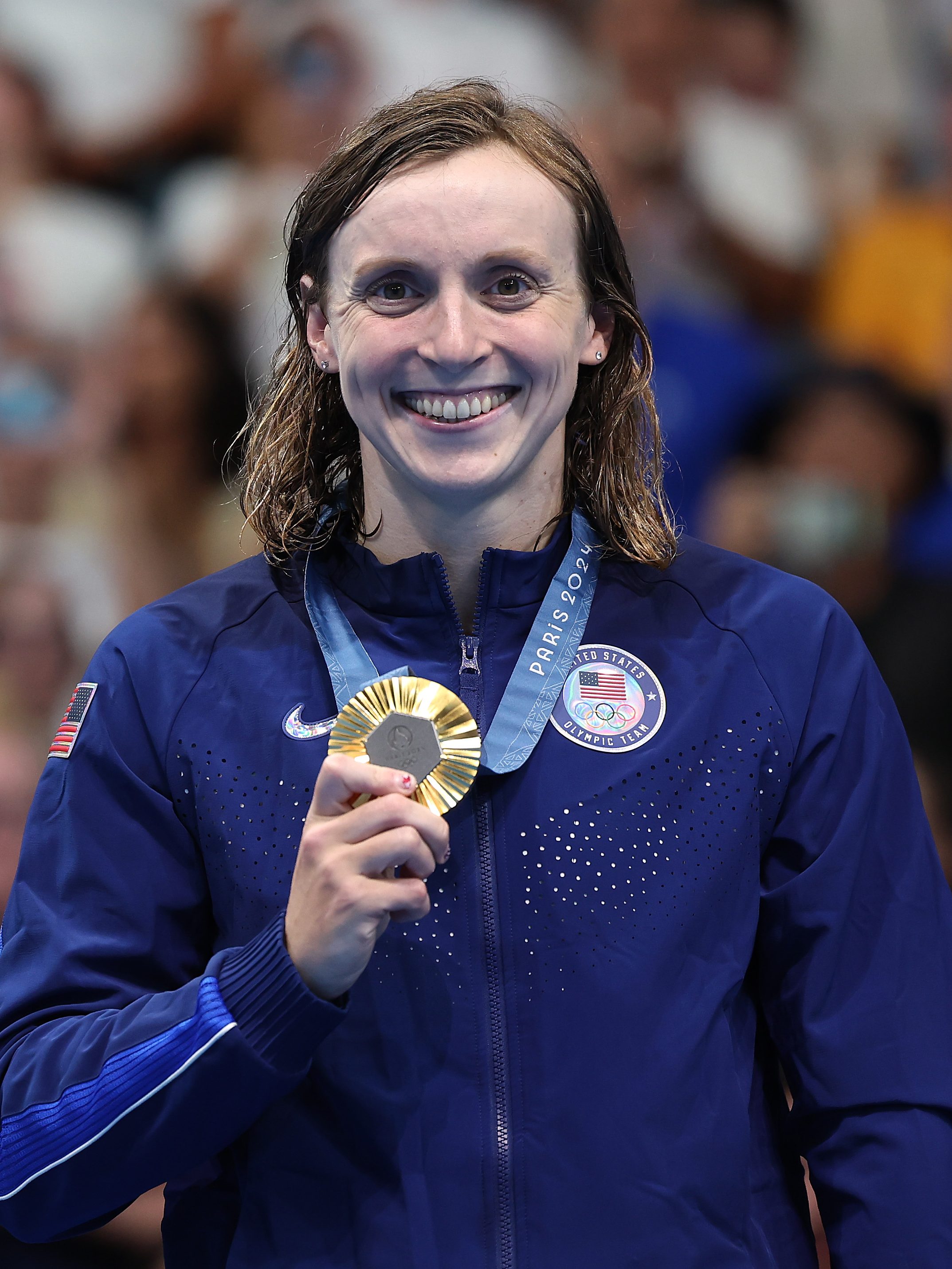 NANTERRE, FRANCE - AUGUST 03: Gold Medalist Katie Ledecky of Team United States poses on the podium during the Swimming medal ceremony after the Women's 800m Freestyle Final on day eight of the Olympic Games Paris 2024 at Paris La Defense Arena on August 03, 2024 in Nanterre, France. (Photo by Quinn Rooney/Getty Images)