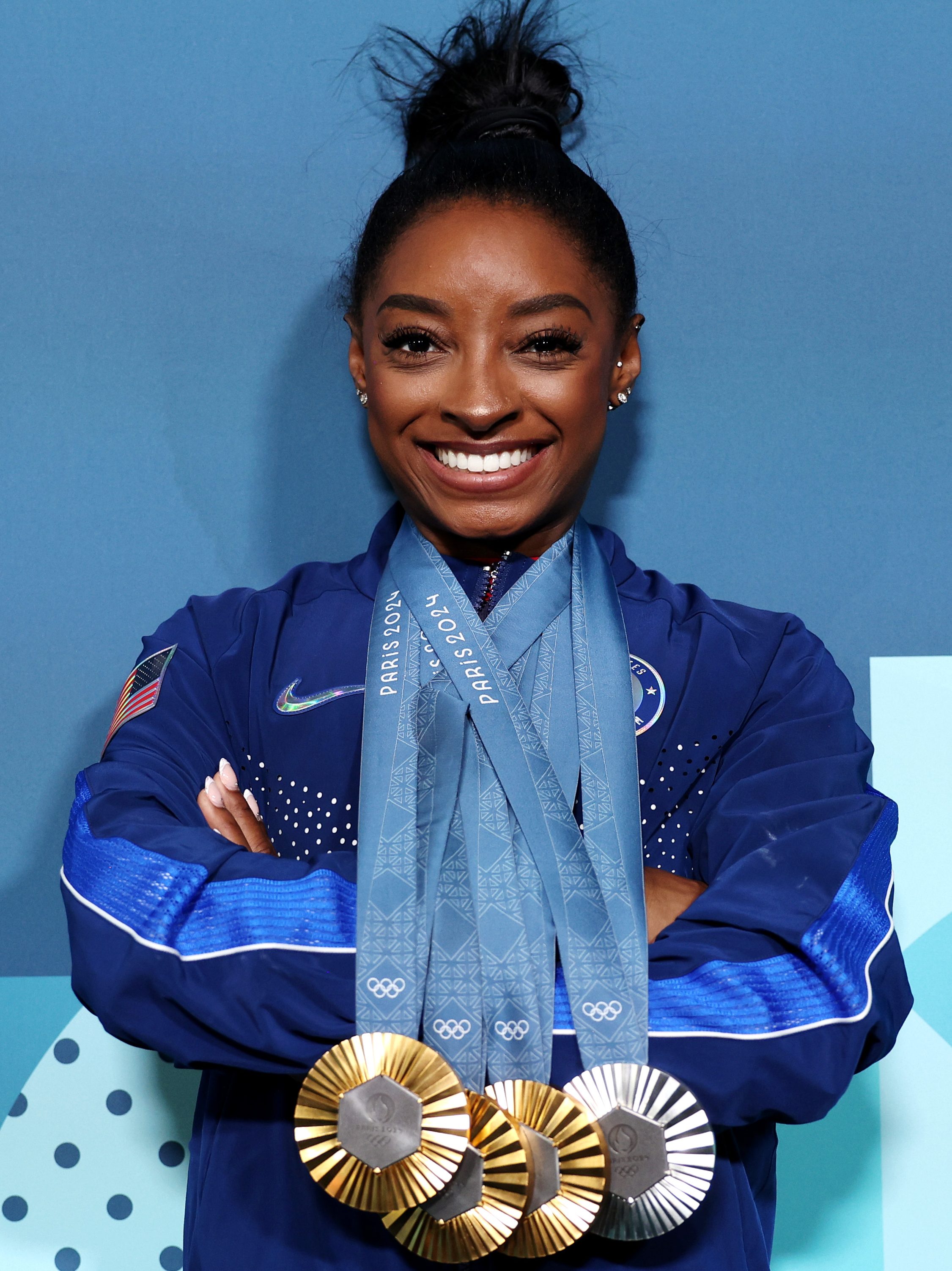 PARIS, FRANCE - AUGUST 05: Simone Biles of Team United States poses with her Paris 2024 Olympic medals following the Artistic Gymnastics Women's Floor Exercise Final on day ten of the Olympic Games Paris 2024 at Bercy Arena on August 05, 2024 in Paris, France. (Photo by Jamie Squire/Getty Images)