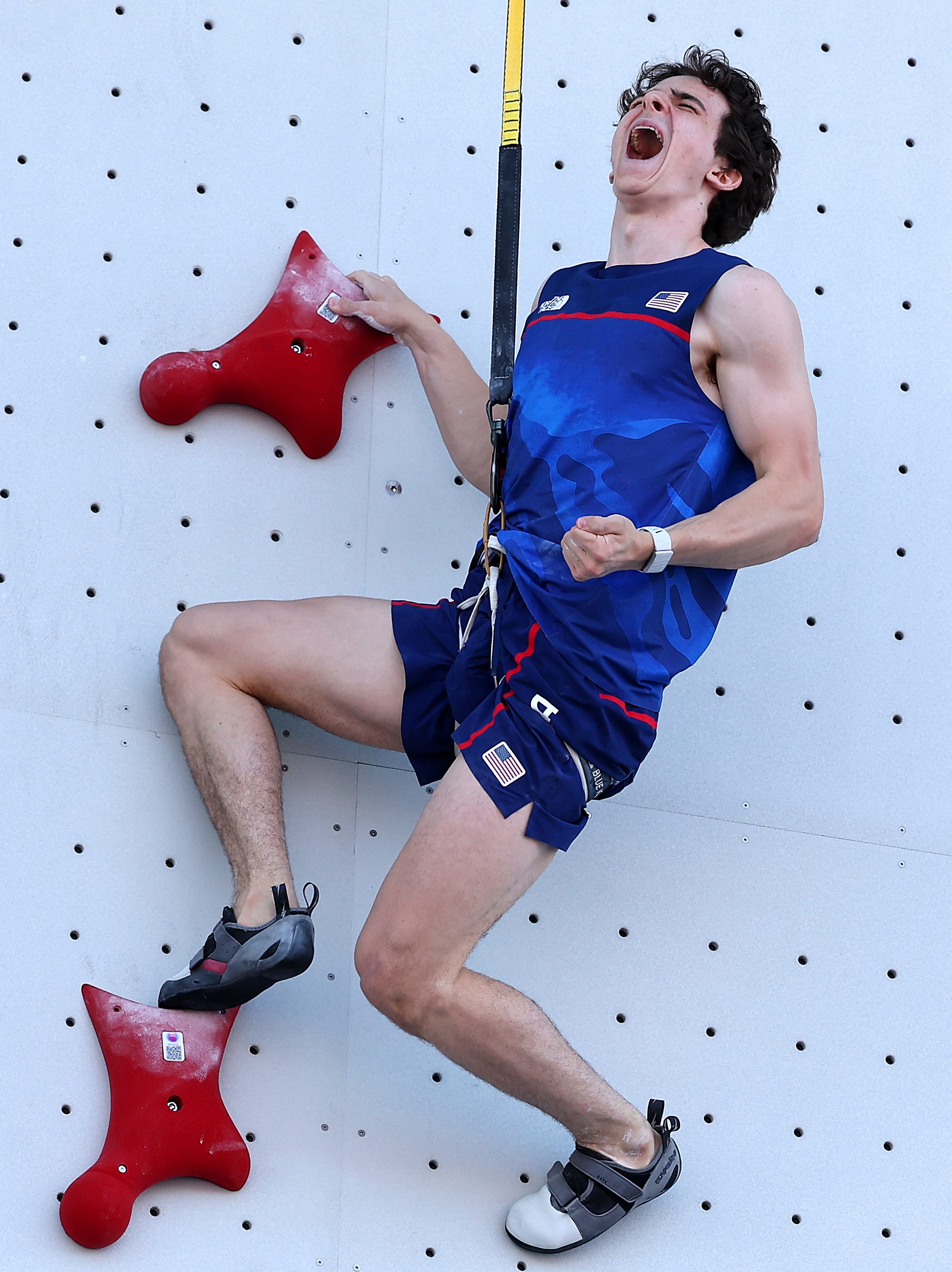 PARIS, FRANCE - AUGUST 06: Sam Watson of Team United States celebrates after setting a new world record of 4.75 seconds during the Men's Speed, Qualification Seeding on day eleven of the Olympic Games Paris 2024 at Le Bourget Sport Climbing Venue on August 06, 2024 in Paris, France. (Photo by Al Bello/Getty Images)