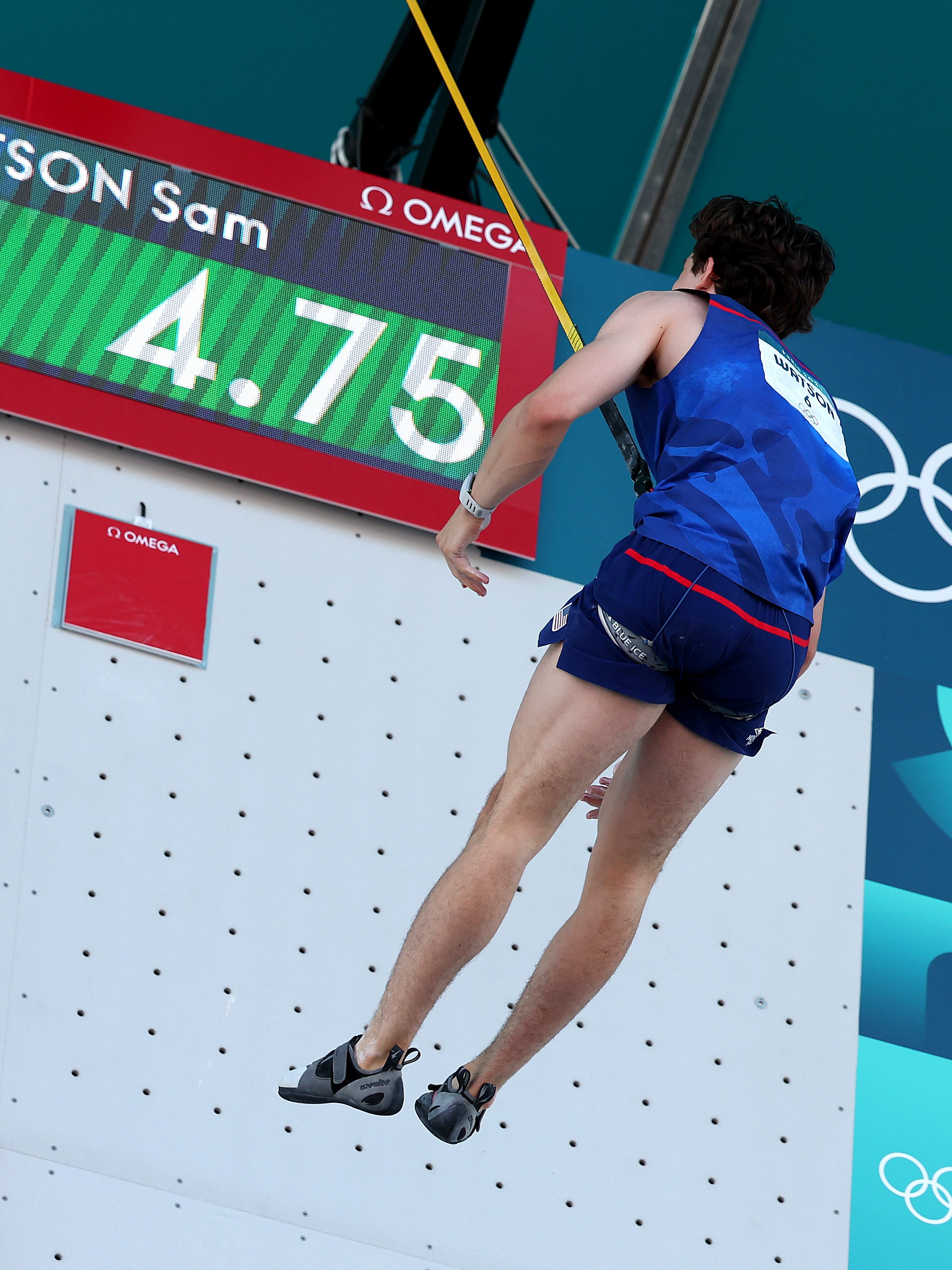 PARIS, FRANCE - AUGUST 06: Sam Watson of Team United States celebrates after setting a new world record of 4.75 seconds during the Men's Speed, Qualification Seeding on day eleven of the Olympic Games Paris 2024 at Le Bourget Sport Climbing Venue on August 06, 2024 in Paris, France. (Photo by Al Bello/Getty Images)
