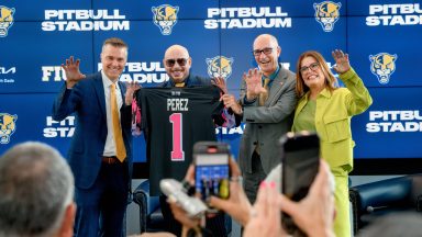 MIAMI, FLORIDA - AUGUST 06: Scott Carr, Pitbull, Kenneth Jessell, and Lucy Benedetti pose during the FIU Pitbull Stadium announcement at Tamiami Hall at Florida International University on August 06, 2024 in Miami, Florida. (Photo by Ivan Apfel/Getty Images)