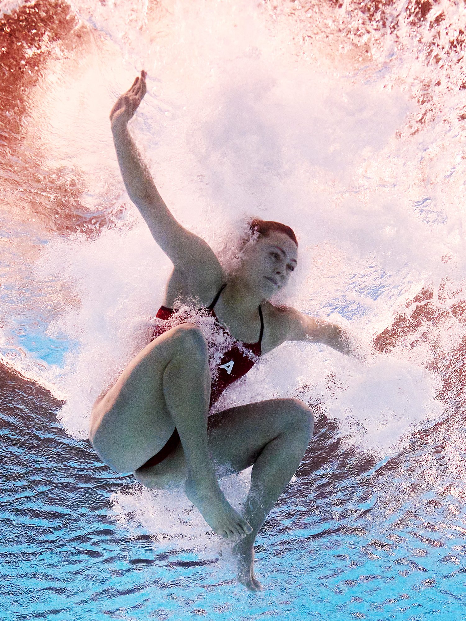 PARIS, FRANCE - AUGUST 07: (EDITORS NOTE: Image was captured using an underwater robotic camera.) Alison Gibson of Team United States competes in the Women's 3m Springboard Preliminaries on day twelve of the Olympic Games Paris 2024 at Aquatics Centre on August 07, 2024 in Paris, France. (Photo by Adam Pretty/Getty Images)