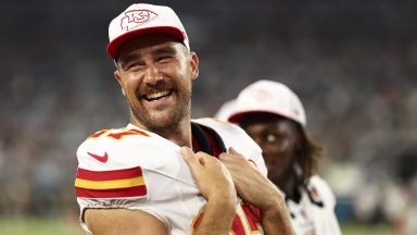 JACKSONVILLE, FL - AUGUST 10: Travis Kelce #87 of the Kansas City Chiefs smiles on the sidelines during the second quarter of an NFL preseason football game against the Jacksonville Jaguars at EverBank Stadium on August 10, 2024 in Jacksonville, Florida. (Photo by Kevin Sabitus/Getty Images)