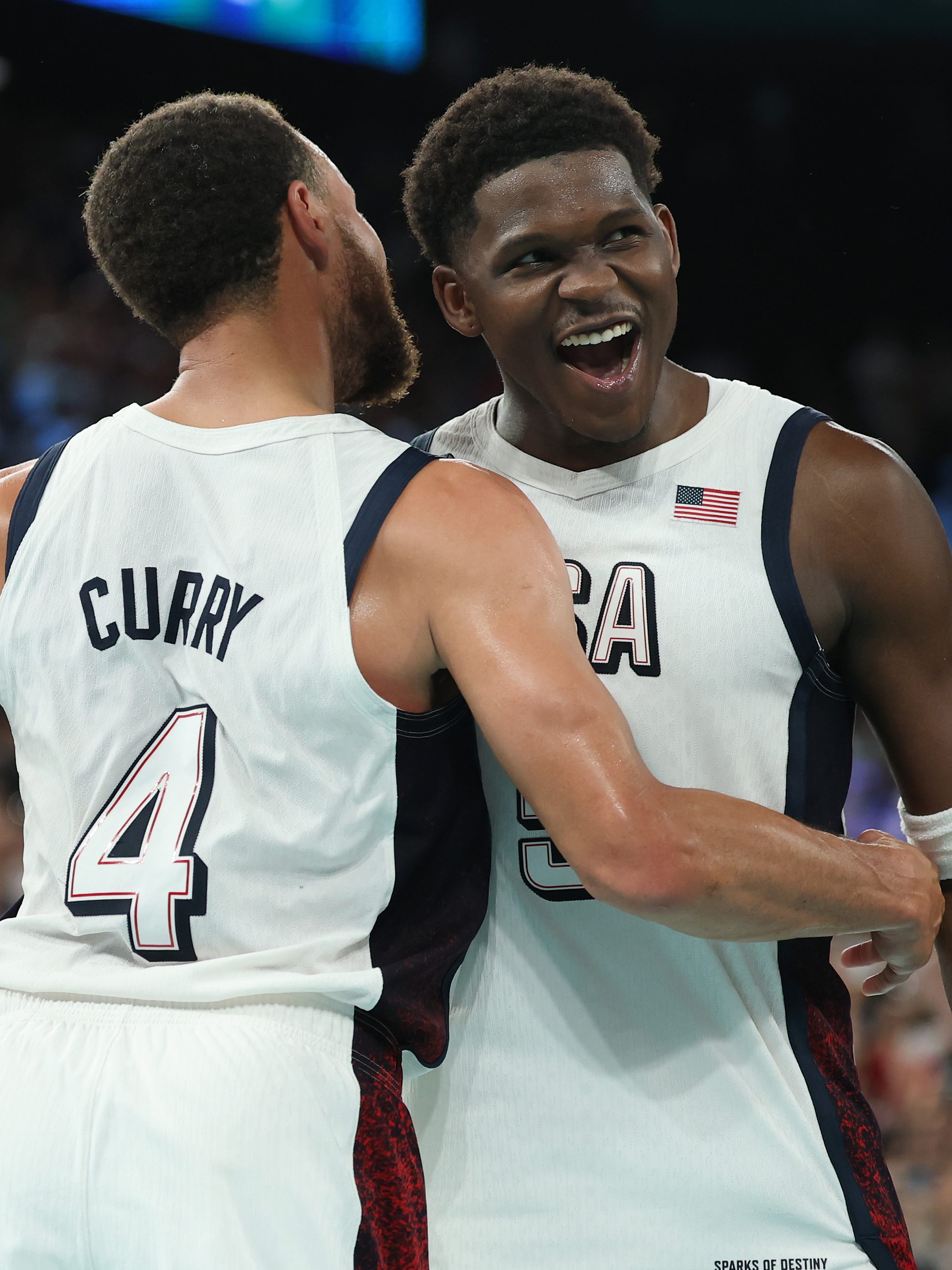 PARIS, FRANCE - AUGUST 08: Stephen Curry #4 and Anthony Edwards #5 of Team United States celebrate during a Men's basketball semifinals match between Team United States and Team Serbia on day thirteen of the Olympic Games Paris 2024 at Bercy Arena on August 08, 2024 in Paris, France. (Photo by Gregory Shamus/Getty Images)