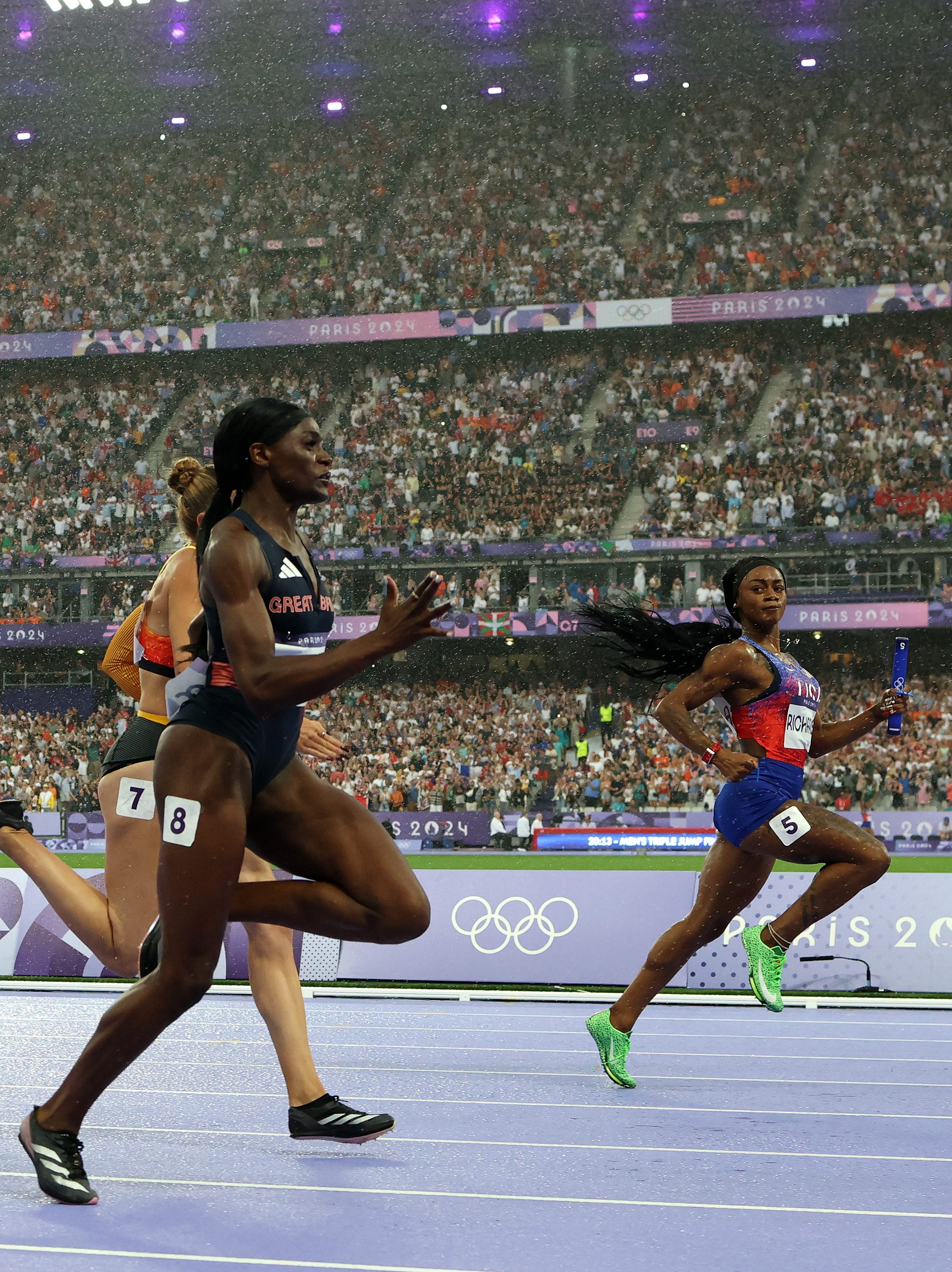 PARIS, FRANCE - AUGUST 09: Sha'carri Richardson looks across to Daryll Neita of Team Great Britain before she accelerates to the line to win the Women's 4 x 100m Relay Final for the USA on day fourteen of the Olympic Games Paris 2024 at Stade de France on August 09, 2024 in Paris, France. (Photo by Richard Heathcote/Getty Images)