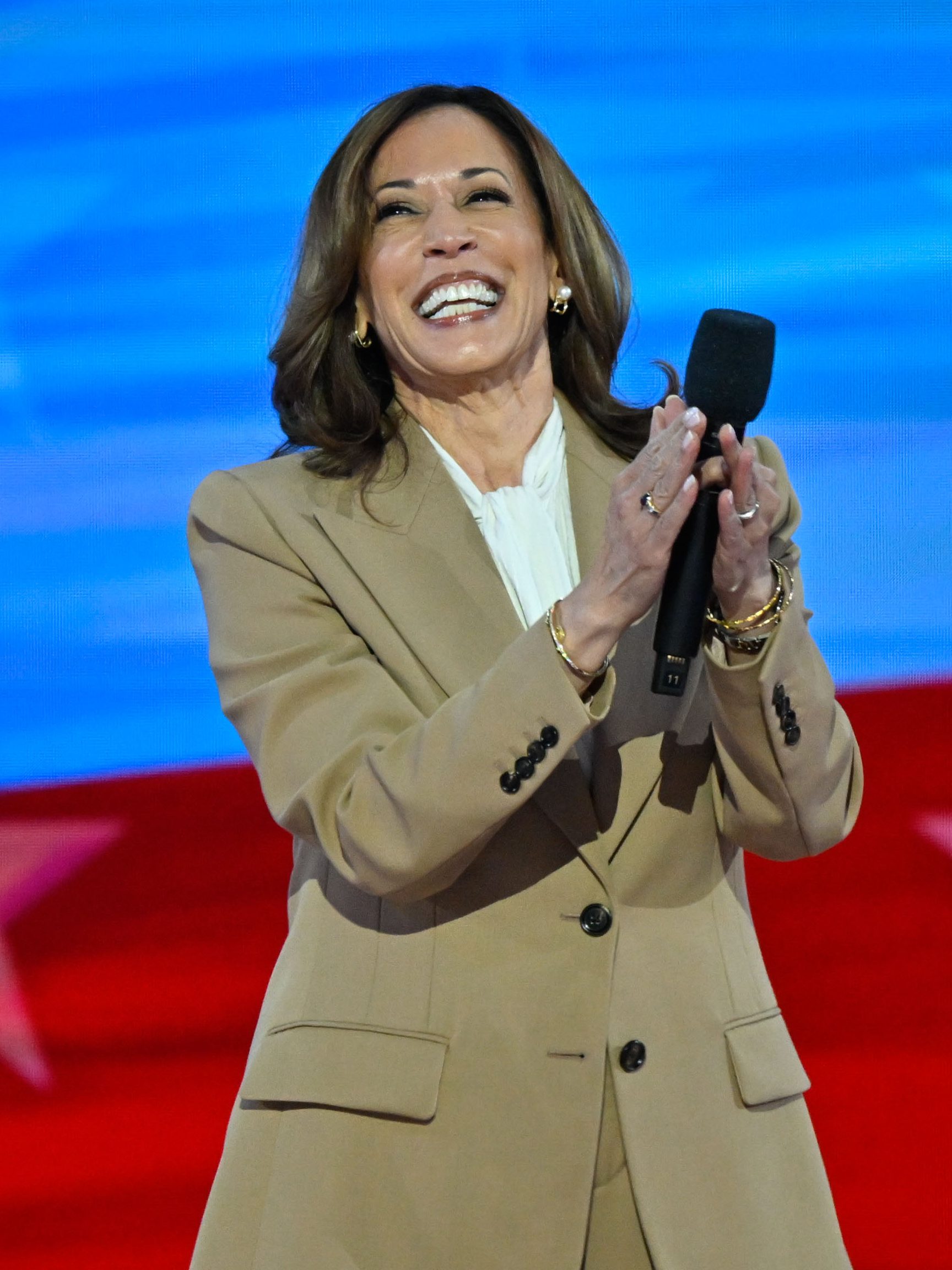 Vice President Kamala Harris walks on stage during the first day of the Democratic National Convention